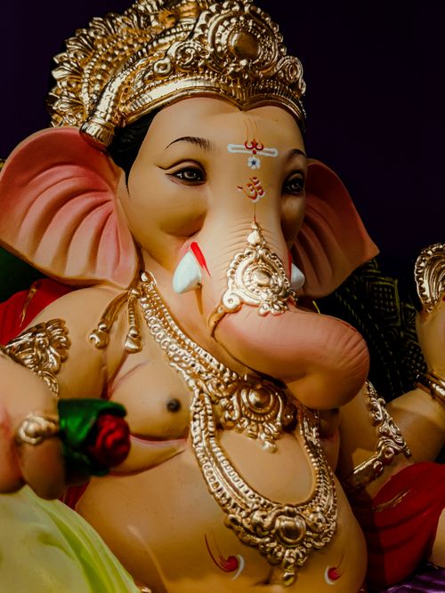 Free Close-up of a beautifully adorned Ganesha statue highlighting Hindu religious art. Stock Photo