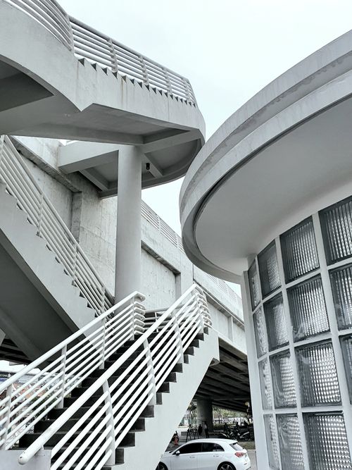 Free Modern architecture featuring spiraling staircases and geometric designs in an urban setting. Stock Photo