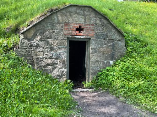 Free A rustic stone doorway set in a vibrant green landscape, perfect for exploring. Stock Photo