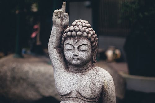 Close-up Photo of Buddhist Sculpture