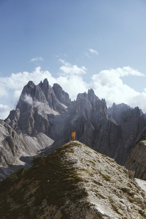 Person near Mountains Peaks