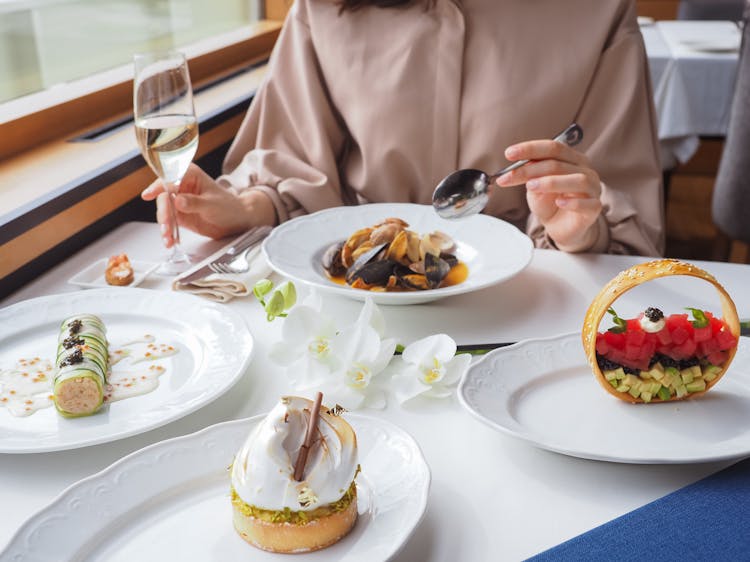 Woman Eating A Meal In A Restaurant 