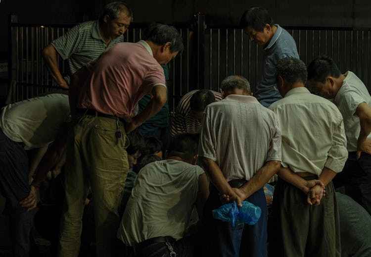 Men Standing In Circle 