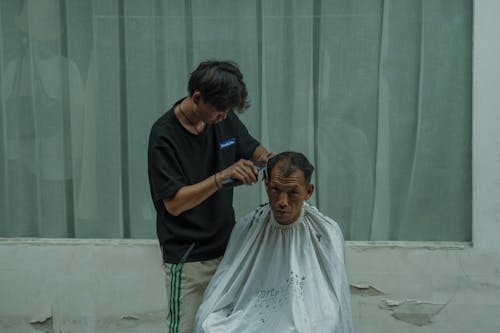 Men during Hair Cutting