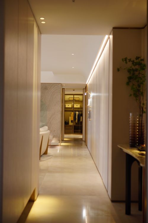 Free Luxurious hotel corridor displaying modern interior design with soft, ambient lighting. Stock Photo