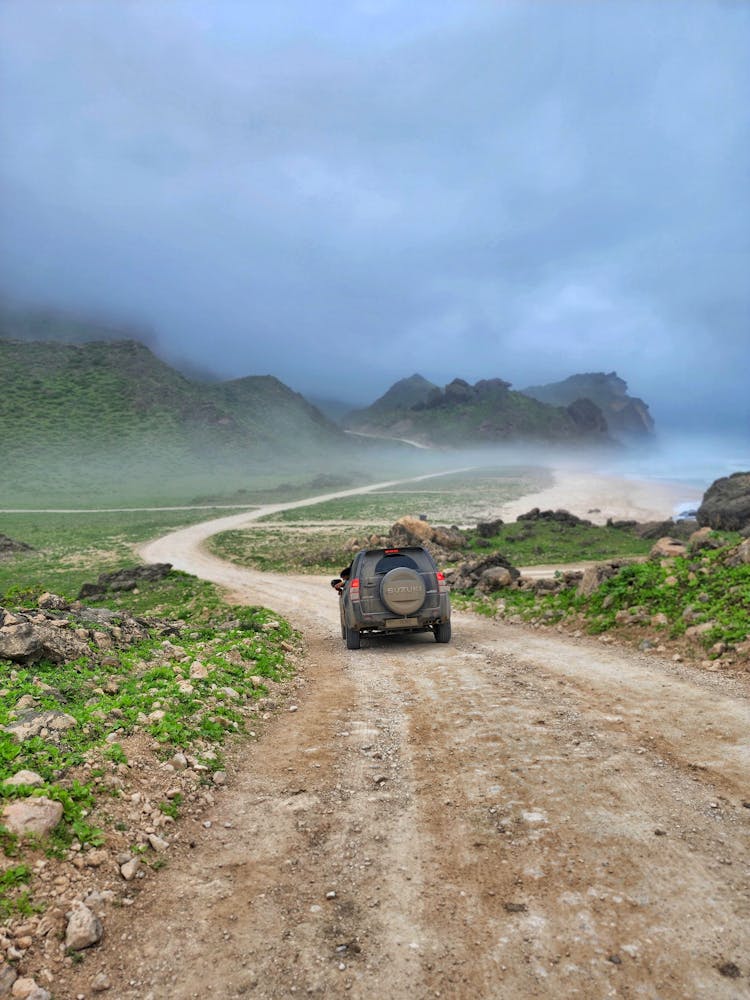 4x4 Truck In An Unpaved Road Near Mountains 