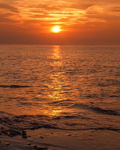 Free Photo of Ocean During Sunset Stock Photo