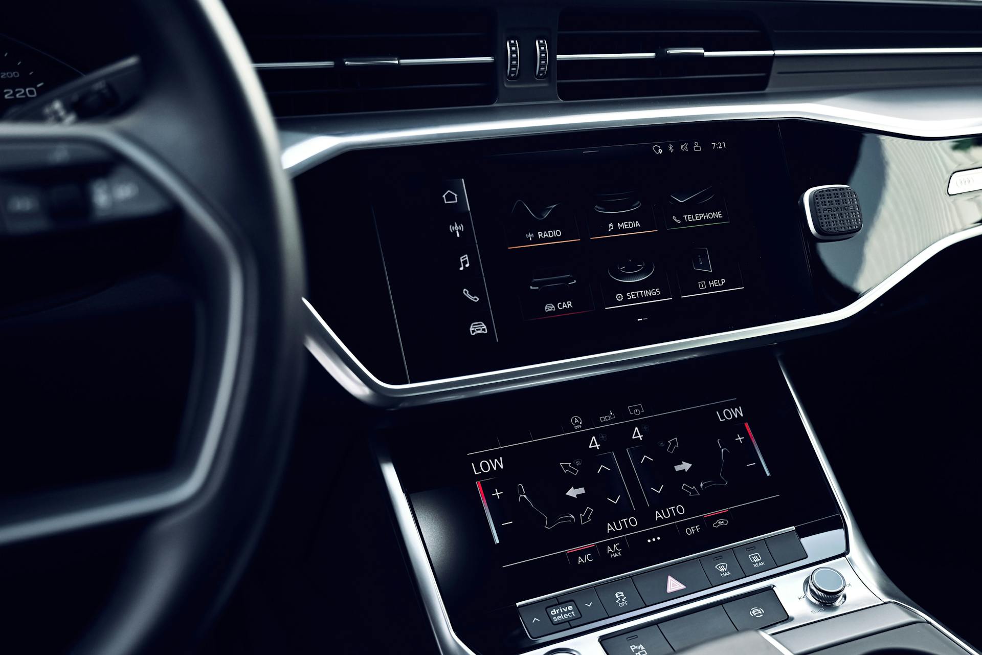 Sleek car interior featuring a digital dashboard with touch screen controls.