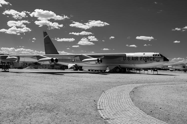 Grayscale Photo Of Fighter Plane On Airport