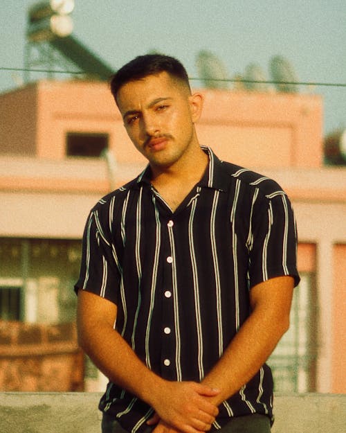 Man Wearing Black and White Polo Shirt