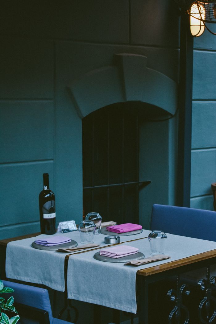 Family gathered around a lamplit dinner table — photo by Ensar on Pexels