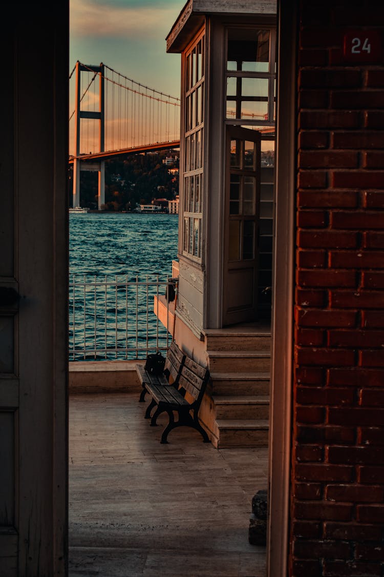 Two Wooden Benches Near The Door Entrance