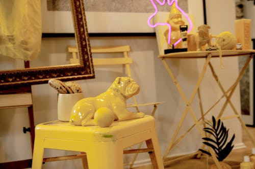 A Yellow Dog Figurine on a Yellow Chair