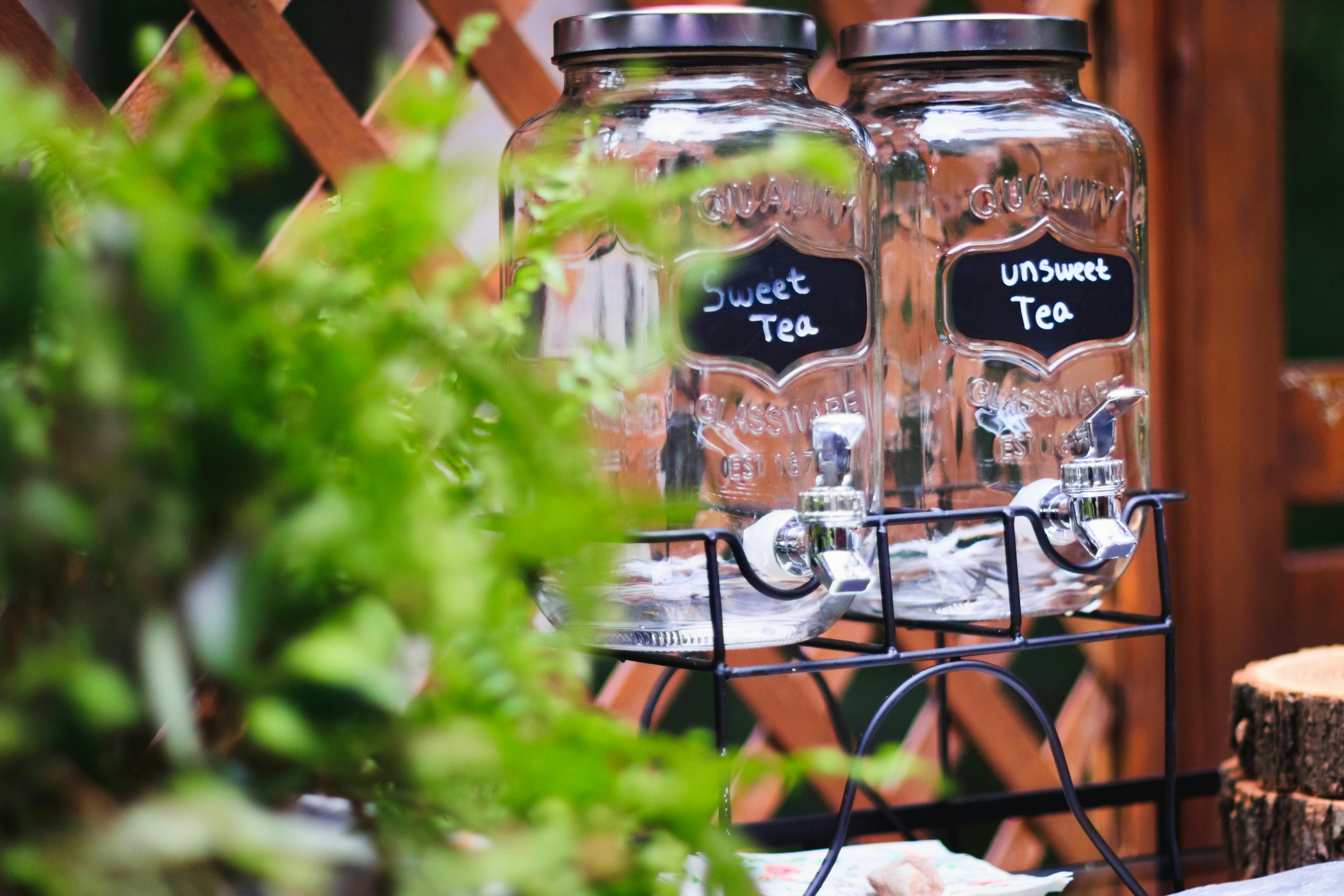 Two Clear Glass Jars On Black Rack \u00b7 Free Stock Photo