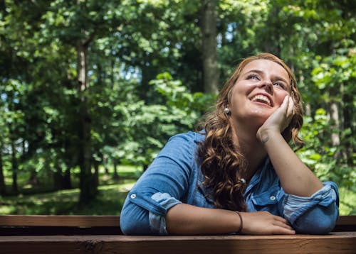 Free Woman Looking Up Smiling Stock Photo