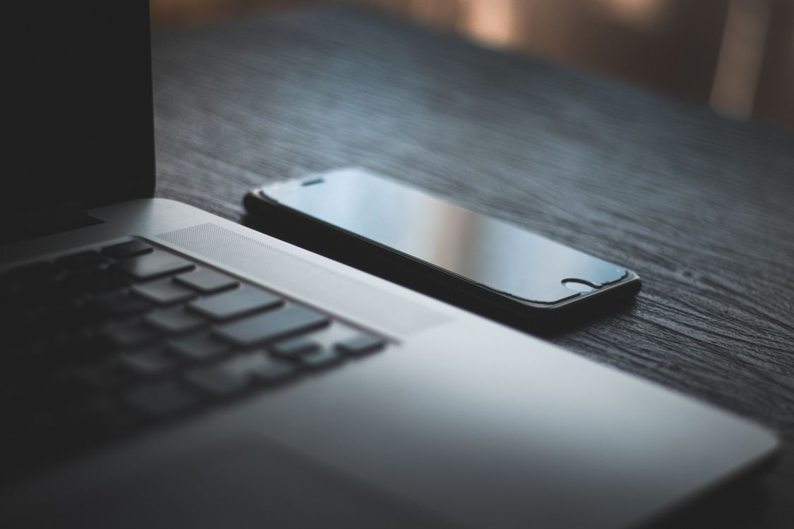 Macbook On A Table · Free Stock Photo