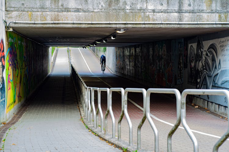 A Tunnel With Graffiti On The Walls 