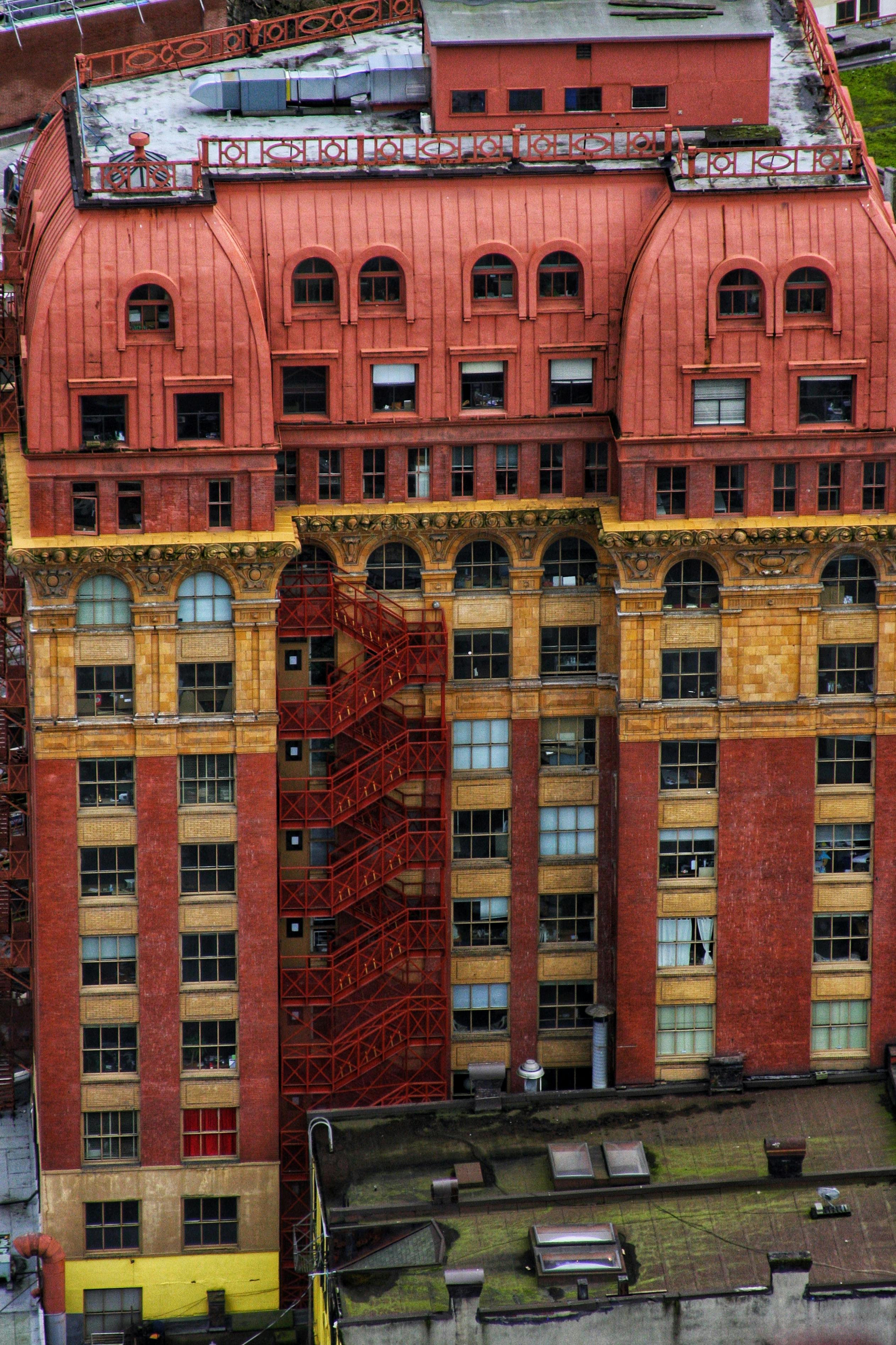 Red and Brown Concrete Building · Free Stock Photo