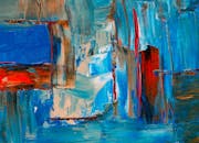 这幅以蓝色和红色为主色调的抽象丙烯画，充满活力，色彩缤纷