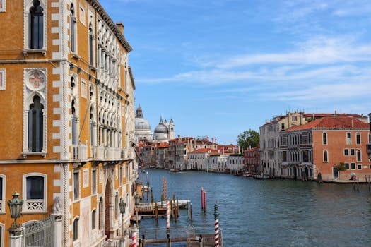 Explore Venice's iconic canals and historic architecture on a sunny day.