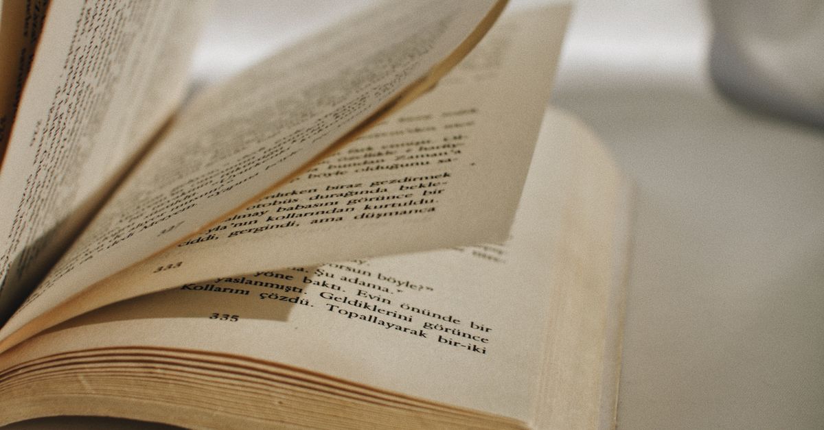 Book Closing Close-Up Shot of a Book · Free Stock Photo
