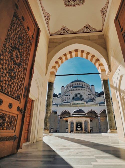 Photo of an Arch with a View of a Mosque 