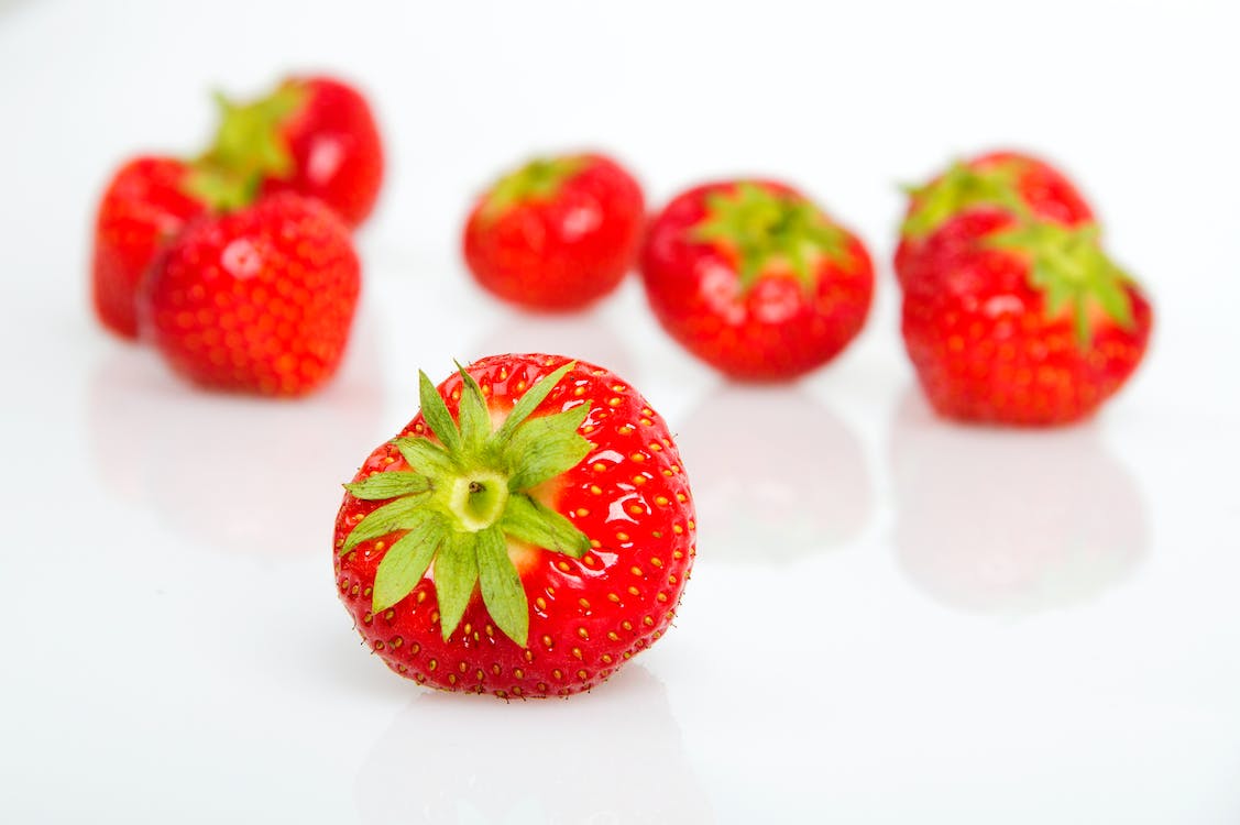 Free Bunch of Strawberries on White Surface Stock Photo