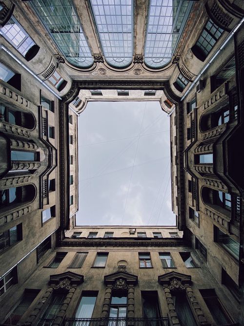 Free A captivating view of a historic building facade from the courtyard in Saint Petersburg, Russia. Stock Photo