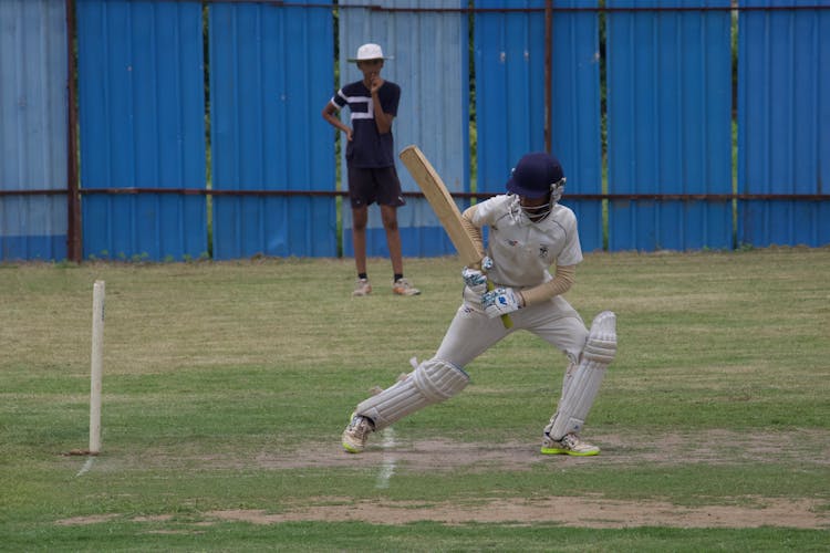 A Man Playing Cricket