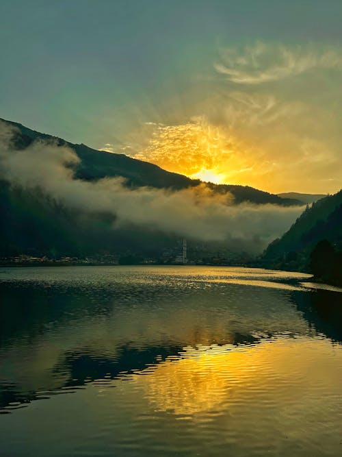 Free Calm Lake near Mountains during Sunset Stock Photo