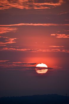 Breathtaking sunset with dramatic clouds and vibrant colors, perfect for nature themes.