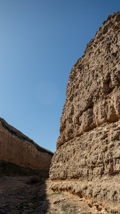 Brown Rock Formation Under Blue Sky