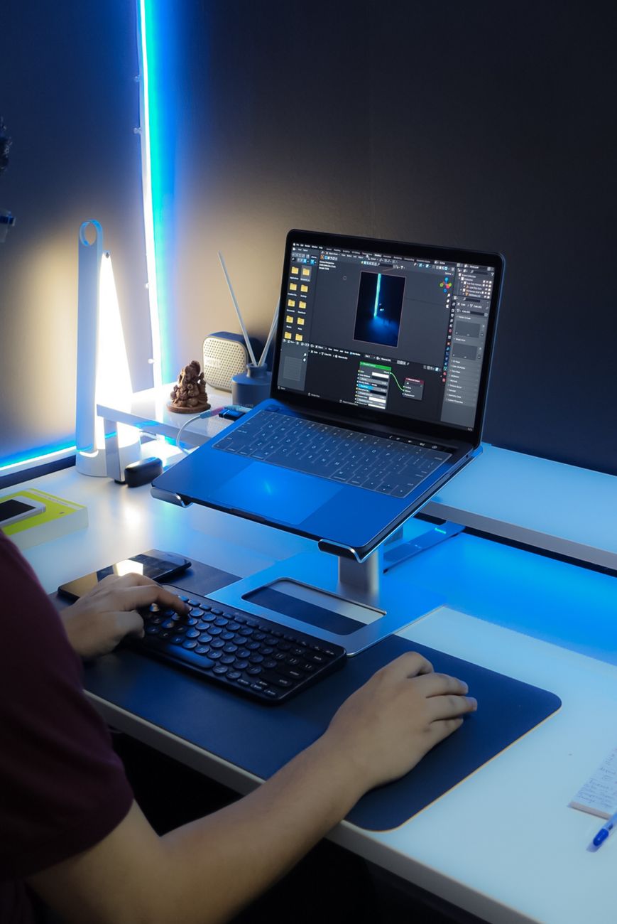 Contemporary desk setup with laptop and RGB lighting, ideal for work from home enthusiasts.. pexels, contemporary, desk