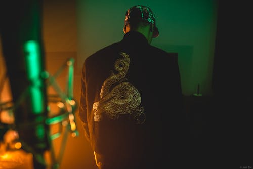Back View of a Man Wearing a Black Jacket