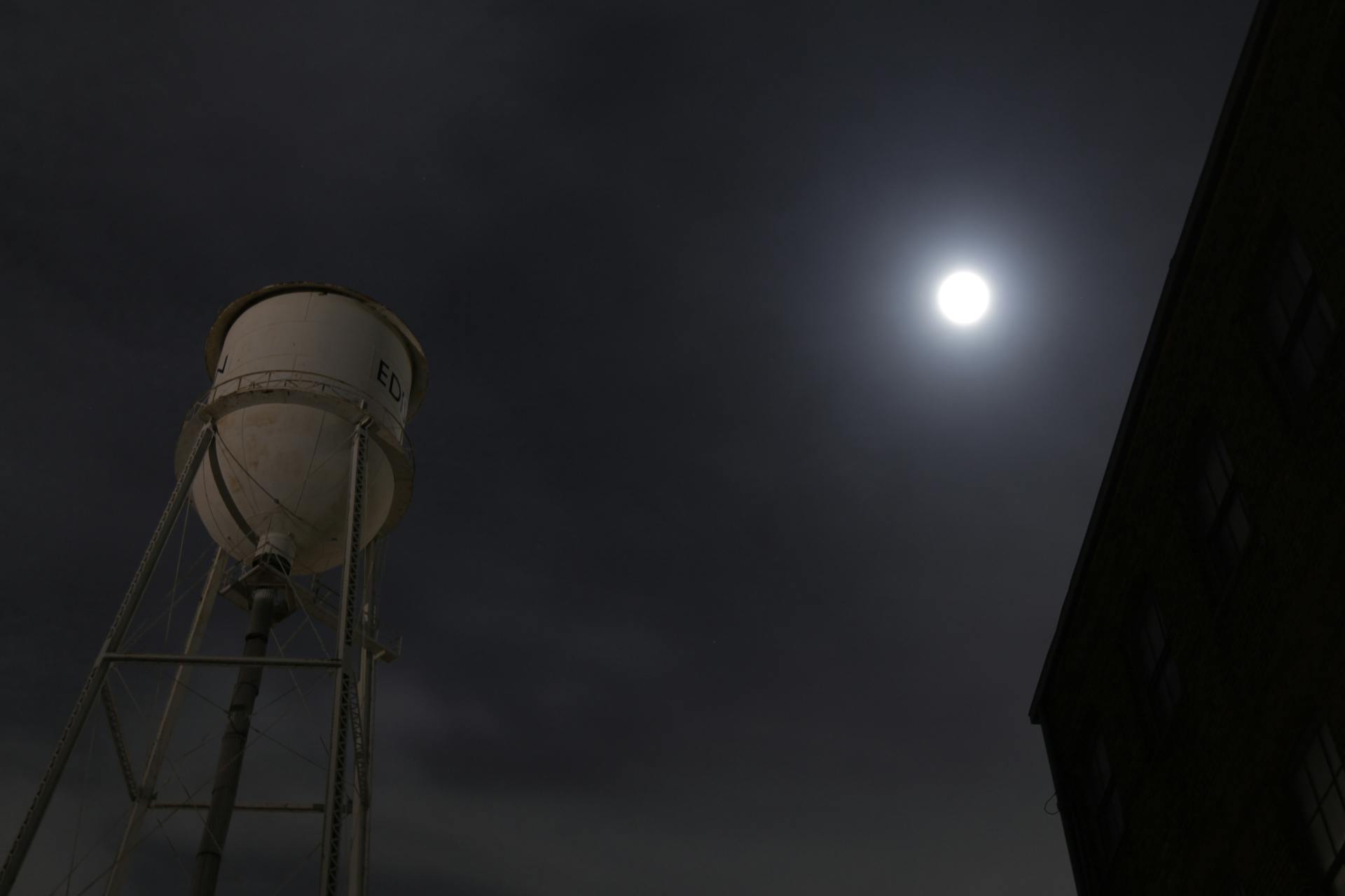Elevated Water Tank Under Full Moon
