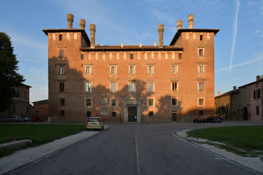 Stunning facade of a historic building in Revere, Lombardia during sunset, showcasing architectural elegance.