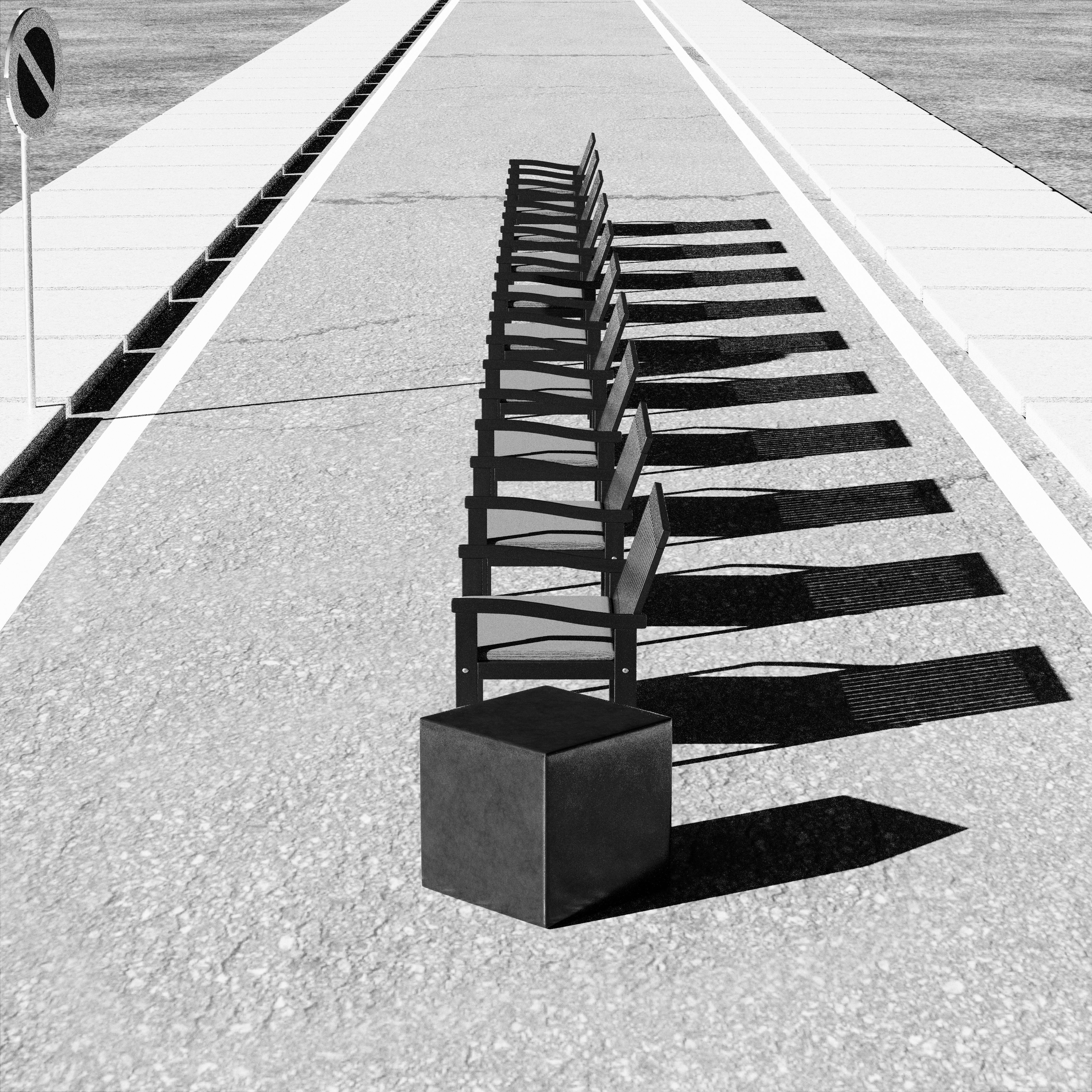 Black and white image of aligned chairs casting shadows on a street in perspective view.