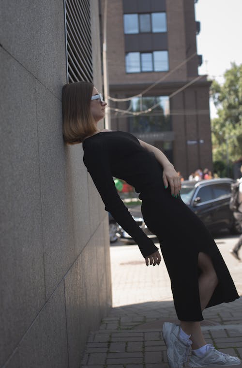 Model Posing in Dress in City