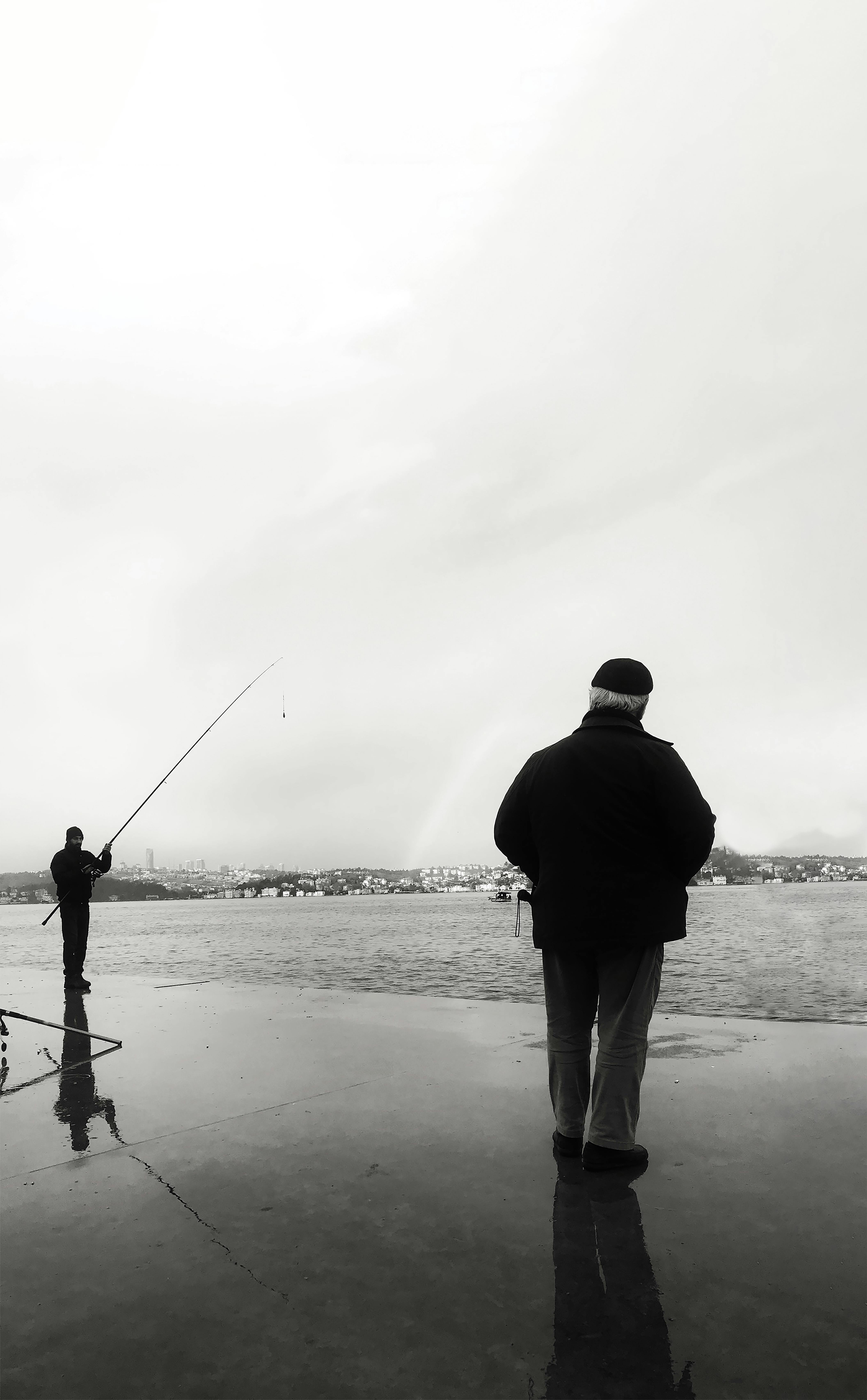 Silhouette of Man Fishing on Sea · Free Stock Photo