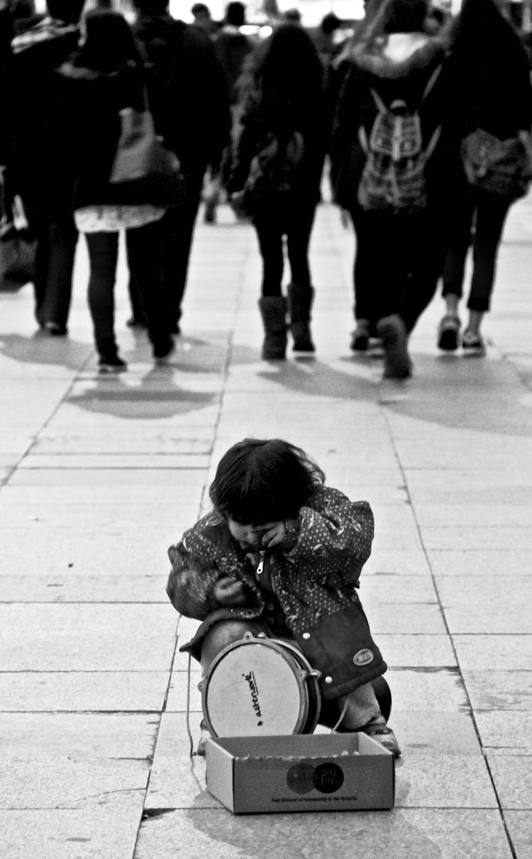 Child Playing On A Street 