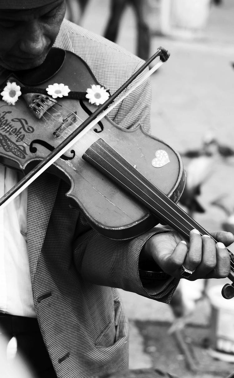 Close-up Of Old Man Playing Violin