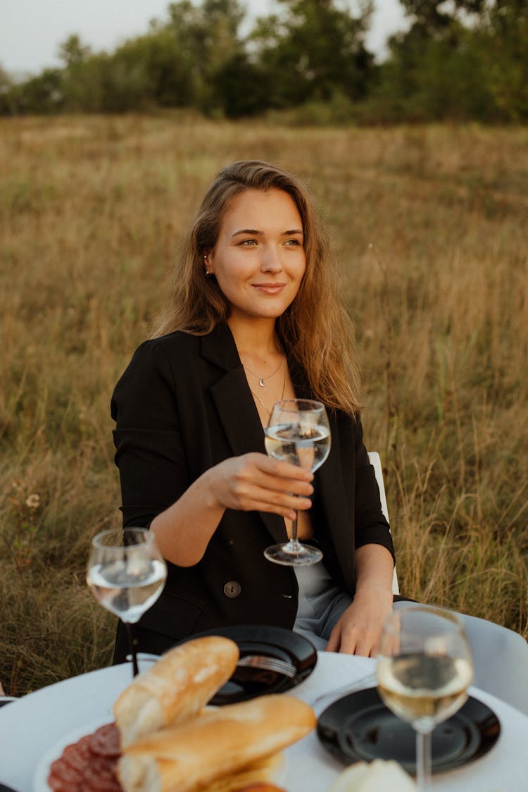 Portrait Of Beautiful Woman Drinking Wine On Picnic