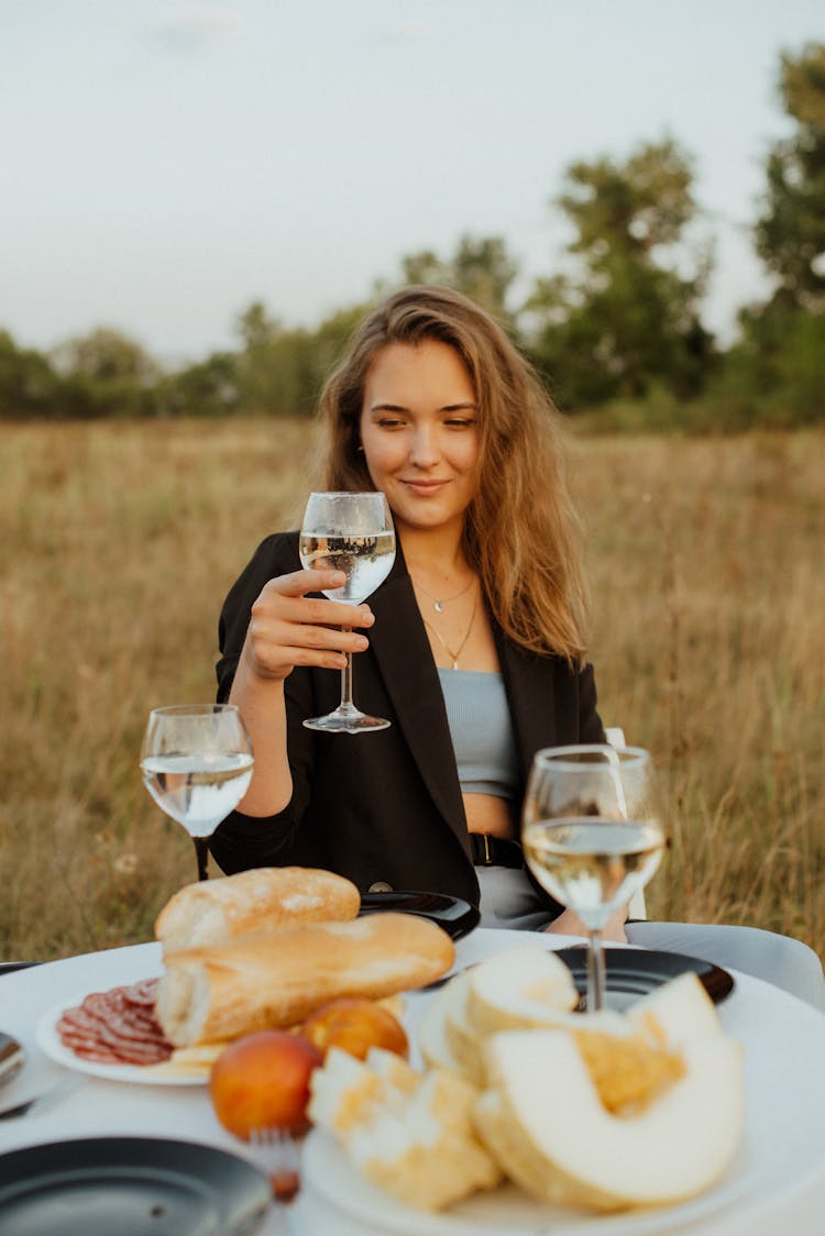 Portrait Of Beautiful Woman Drinking Wine On Picnic