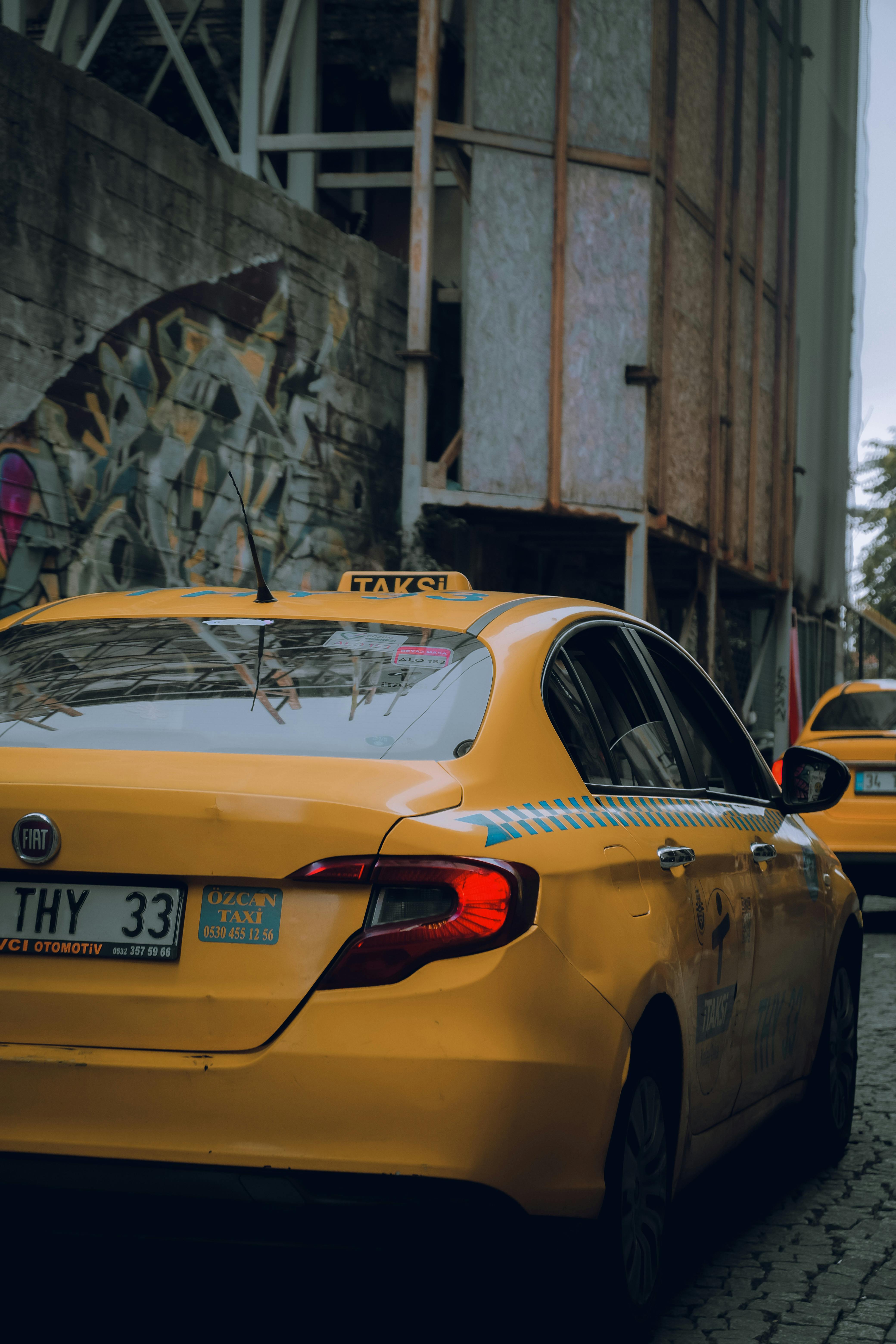 yellow taxi cars on road