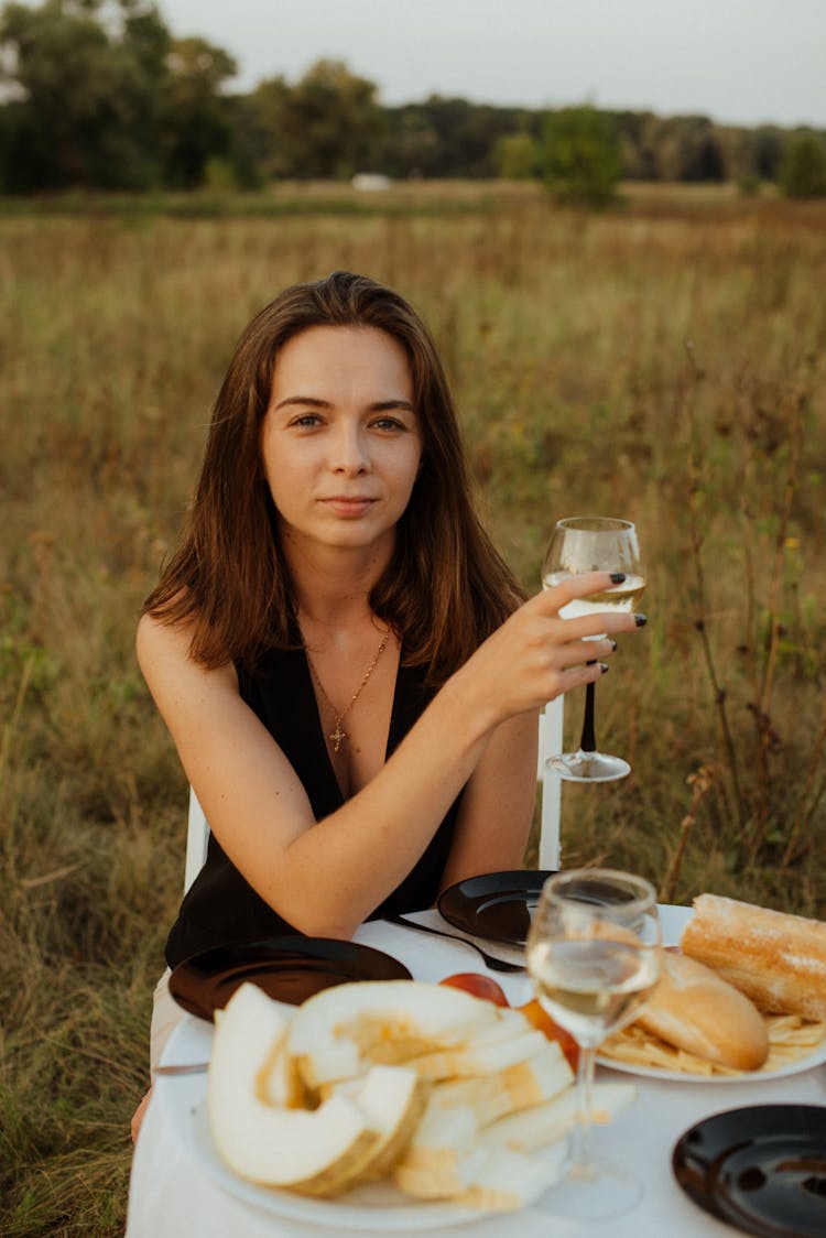 Portrait Of Beautiful Woman Drinking Wine On Picnic