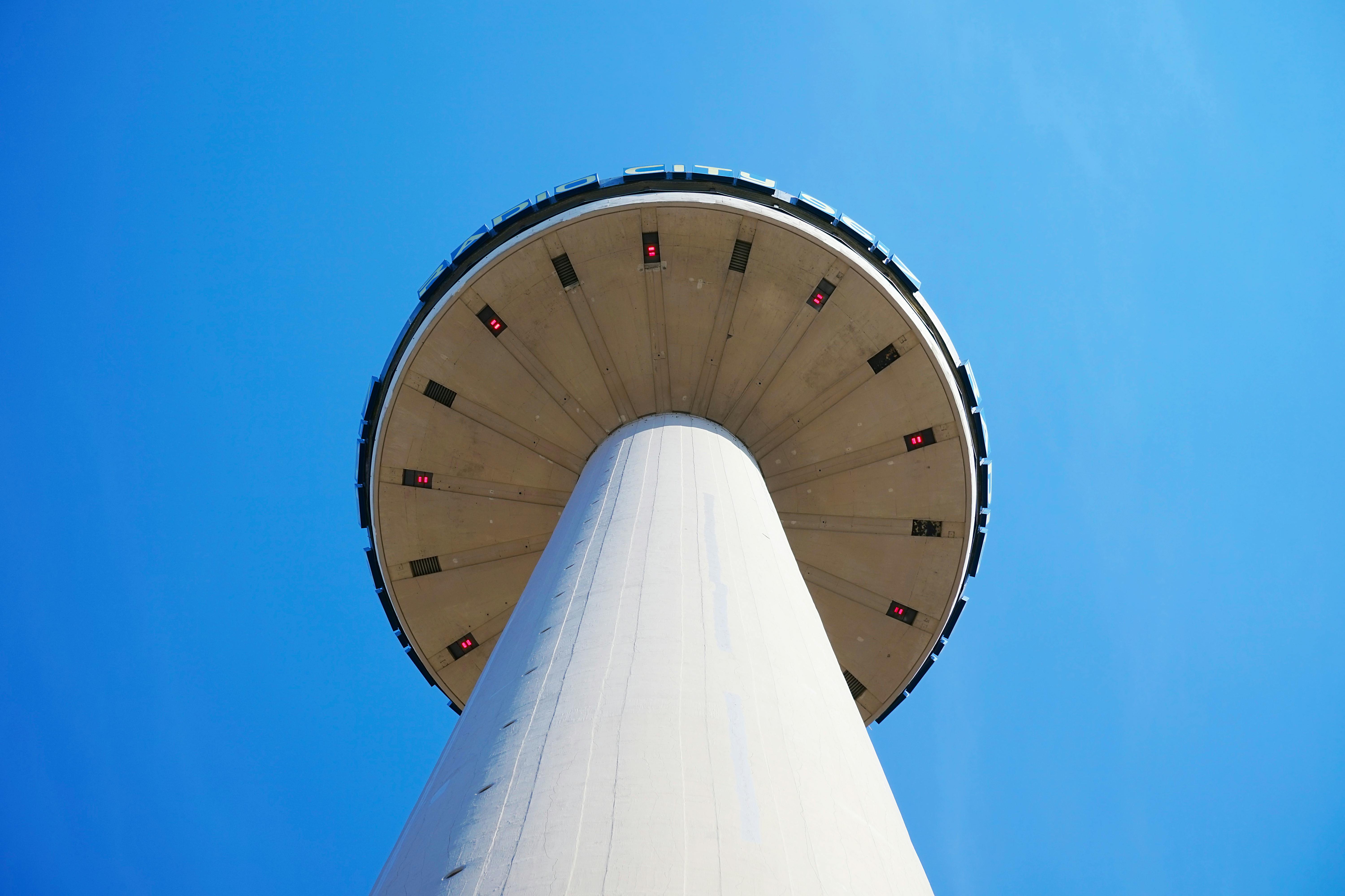 Dynamic low angle shot of St. John's Beacon against a clear blue sky in Liverpool.