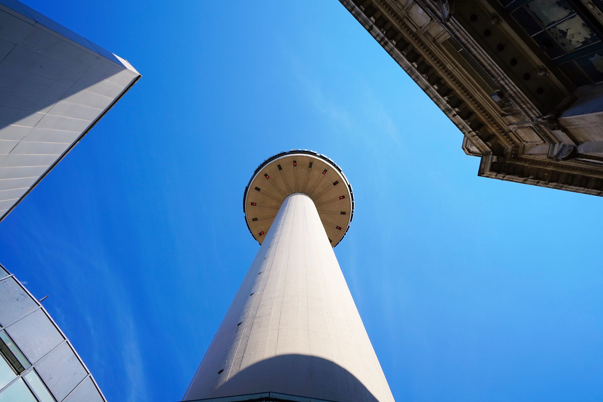 Low angle shot of Liverpool's iconic Radio City Tower against a clear blue sky.