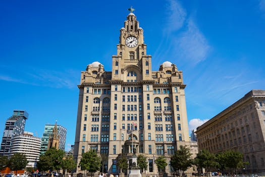 The iconic Royal Liver Building under a clear blue sky in Liverpool, a historical architectural landmark.