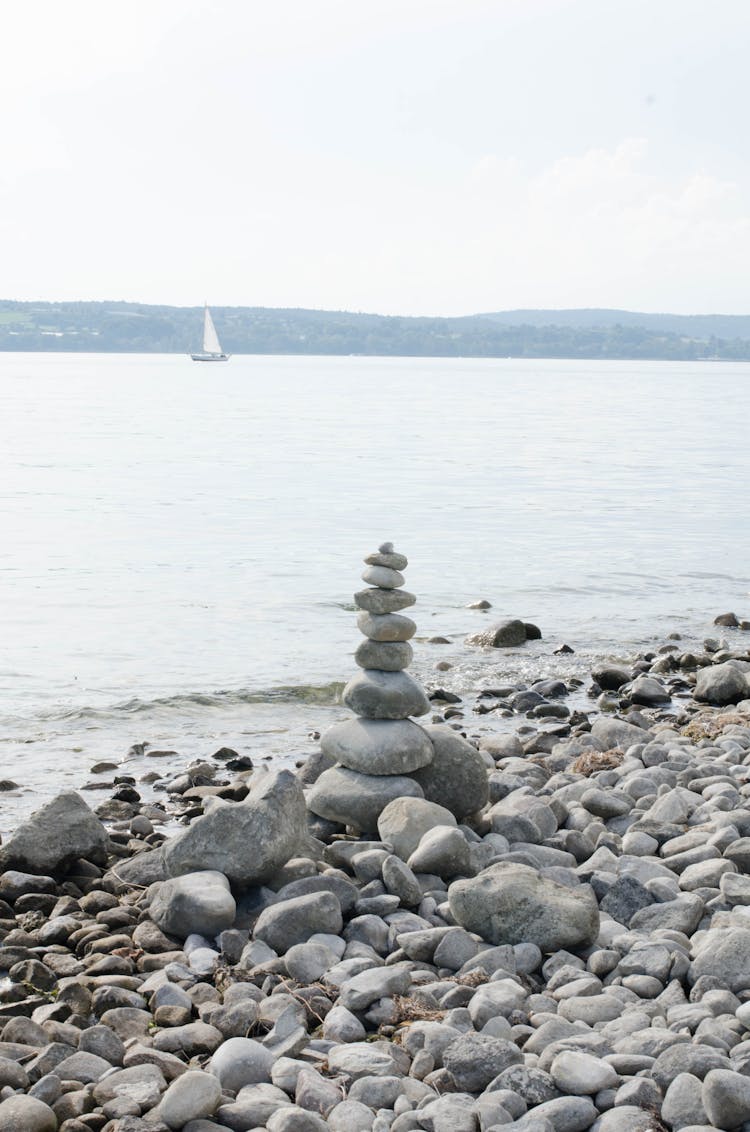 Stones Stacked On Sea Shore