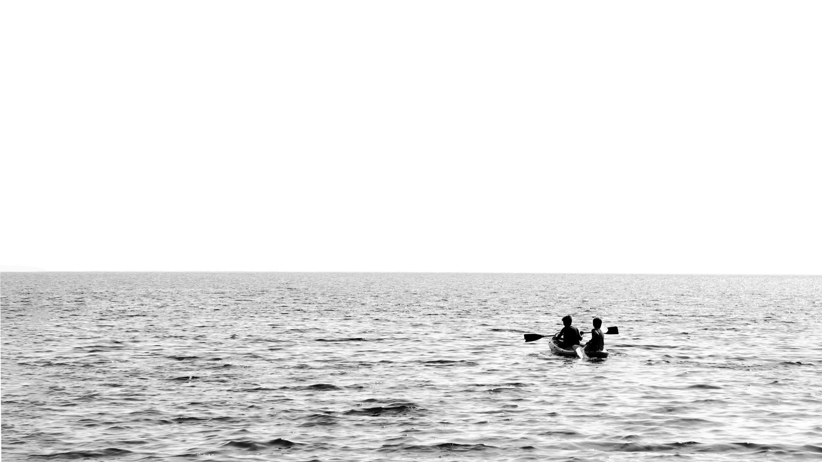 Grayscale photo of people riding a boat in water, Gabon